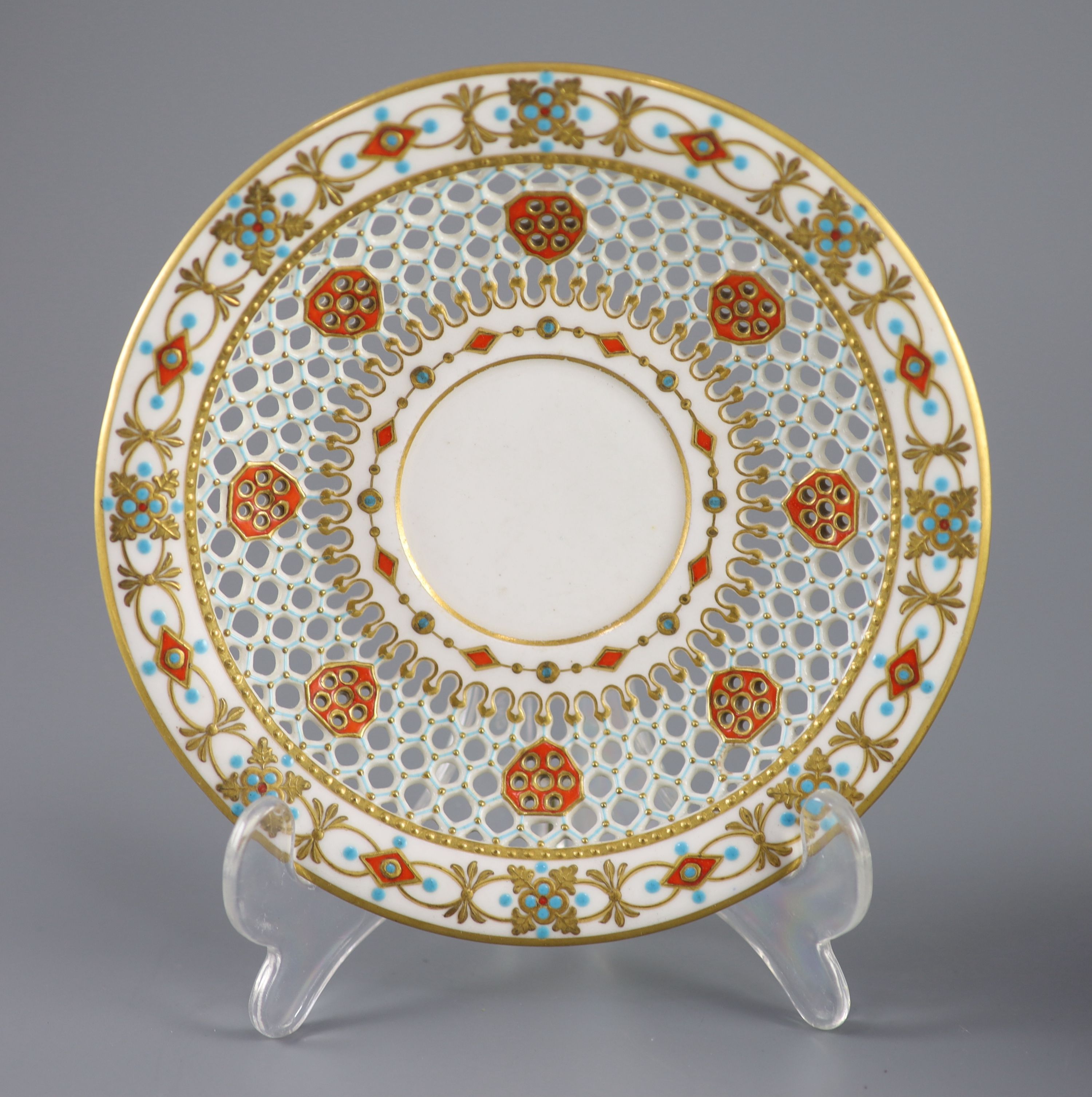 A Royal Worcester 'jewelled' and reticulated cup and saucer